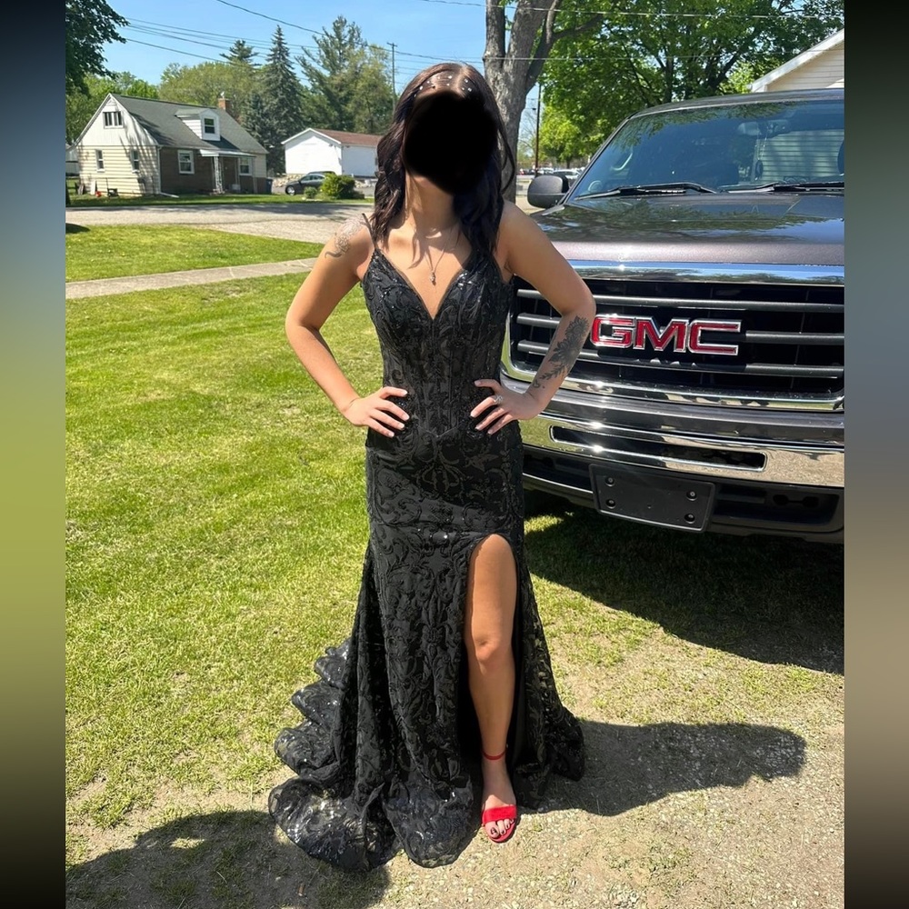 Beautiful Black Prom Gown. Has a small train, Size 2. Over $500, worn once.
